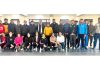 Selected boys and girls fencing teams posing along with dignitaries.