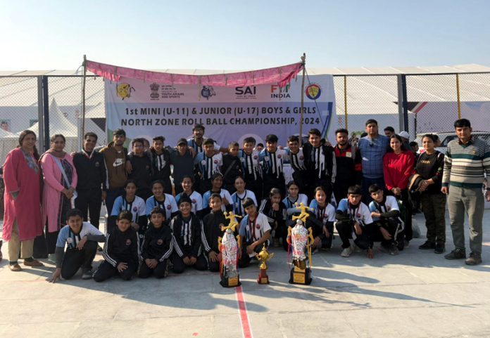 J&K Rollball teams posing along with trophies at Dehradun. J&K Rollball teams posing along with trophies at Dehradun.