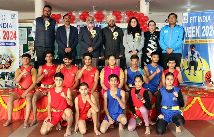 Dignitaries posing along with Wushu athletes during FIT India awareness programme.