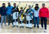 Mission Olympics shooters posing along with coaching staff.