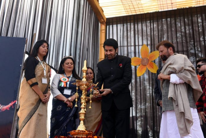 Balwant Thakur along with Choudhary Lal Singh lighting traditional lamp during a programme at DPS Kathua.
