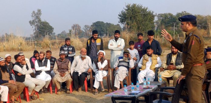 A police officer interacting with the Gujjar community members during a police-public meeting at Kanachak area on Friday. A police officer interacting with the Gujjar community members during a police-public meeting at Kanachak area on Friday.