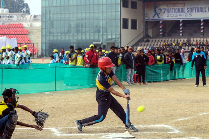Softball players in action during a match at MA Stadium Jammu. Softball players in action during a match at MA Stadium Jammu.