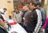 Relief and Rehabilitation Commissioner, Dr Arvind Karwani interacting with migrants during an outreach programme at Tope Sherkhania.