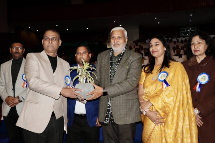 Sham Lal Sharma, MLA Jammu North receiving a plant from management of Elite Public High School. Sham Lal Sharma, MLA Jammu North receiving a plant from management of Elite Public High School.