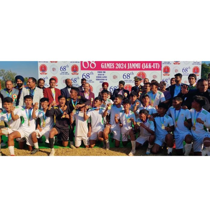 Meghalaya football team posing along with medals during prize distribution ceremony.