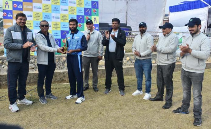 Dignitary presenting man of the match award to a player on Day 2 of POWERGRID Inter-Regional Cricket Tournament 2024.