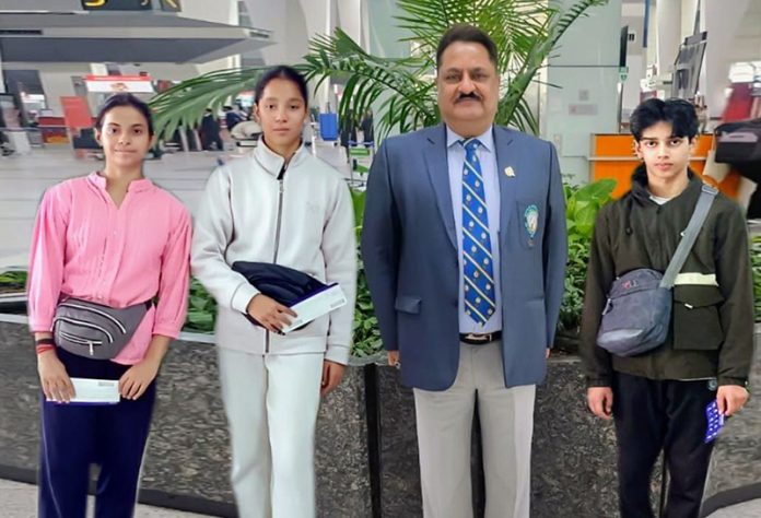 President Gymnastics Association J&K, Er. Kiran Wattal posing along with gymnasts. President Gymnastics Association J&K, Er. Kiran Wattal posing along with gymnasts.