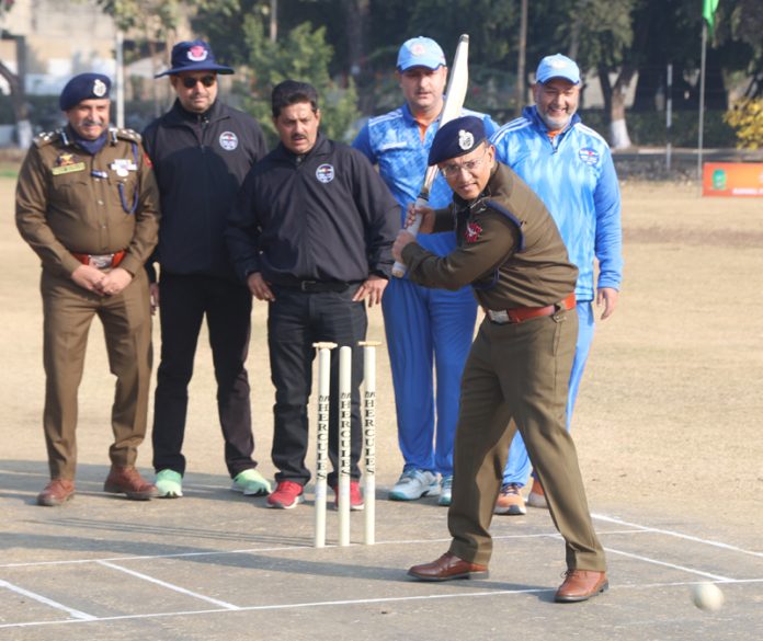 ADGP Jammu Zone, Anand Jain displaying his batting skills during inaugural event of India-UAE Masters Cup 2024 at Jammu University Cricket Ground. — Excelsior/Rakesh
