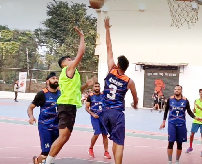 Players in action during ongoing J&K Senior Basketball Championship at MA Stadium. Players in action during ongoing J&K Senior Basketball Championship at MA Stadium.