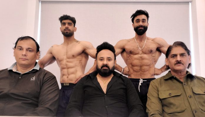 Bodybuilders posing along with dignitaries. Bodybuilders posing along with dignitaries.
