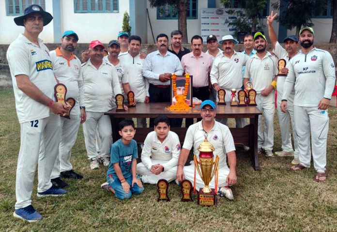 Winning team posing along with trophies. Winning team posing along with trophies.