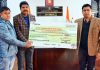 CMO Poonch Dr Parvaizm Khan getting the cheque for TB patients from DC Poonch Vikas Kundal.