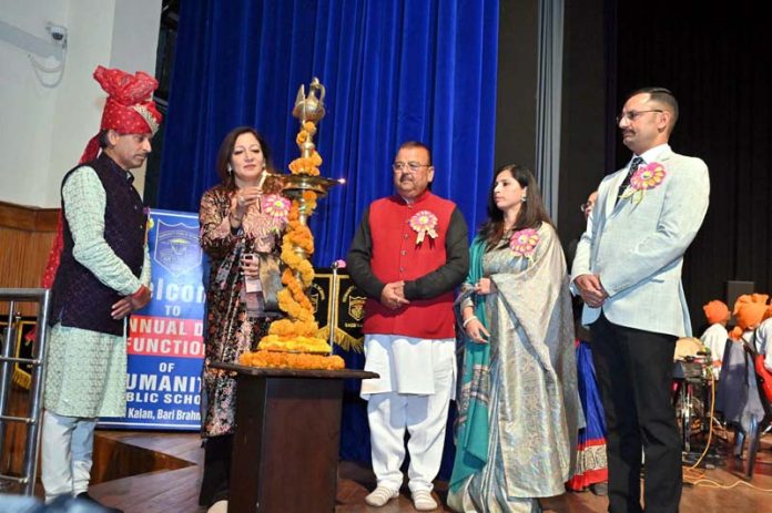 Chander Prakash Ganga, MLA from Vijaypur along with others lighting traditional lamp during Annual Day event of Humanity Public School. Chander Prakash Ganga, MLA from Vijaypur along with others lighting traditional lamp during Annual Day event of Humanity Public School.