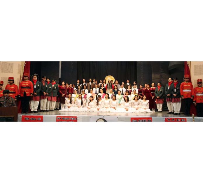 Students of Presentation Convent Senior Secondary School posing for group photograph along with dignitaries during Annual Day event.
