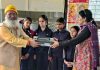 000Dr Sushil Wattal head of Puruppkar Trust distributing heat converters among the children of Girls School Roopnagar.
