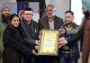 A JKAS exam qualifier girl from Poonch being felicitated by Aasra Charitable Trust Chairman, Rayaz Tantray and other members of Trust.