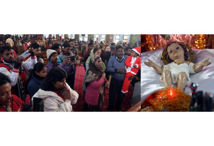 People offering prayers at St Mary's Garrison Church in Gandhi Nagar during Christmas celebration on Wednesday. —Excelsior/Rakesh People offering prayers at St Mary's Garrison Church in Gandhi Nagar during Christmas celebration on Wednesday. —Excelsior/Rakesh