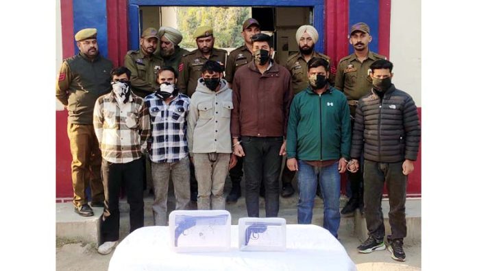 Accused in custody of police and weapons recovered from their possession.