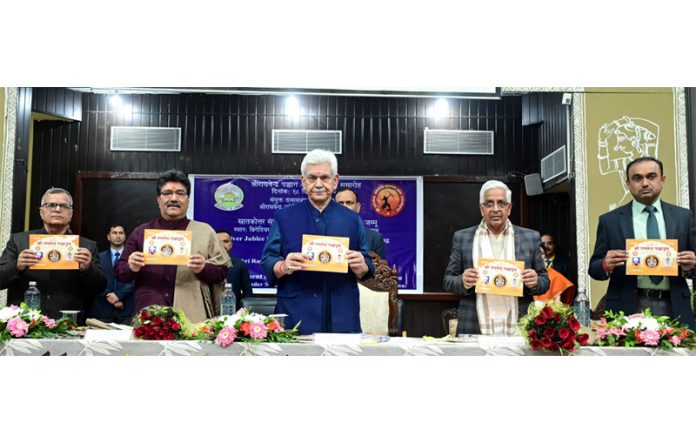 LG Manoj Sinha along with officials displaying Shri Raghvendra Panchang on Wednesday.