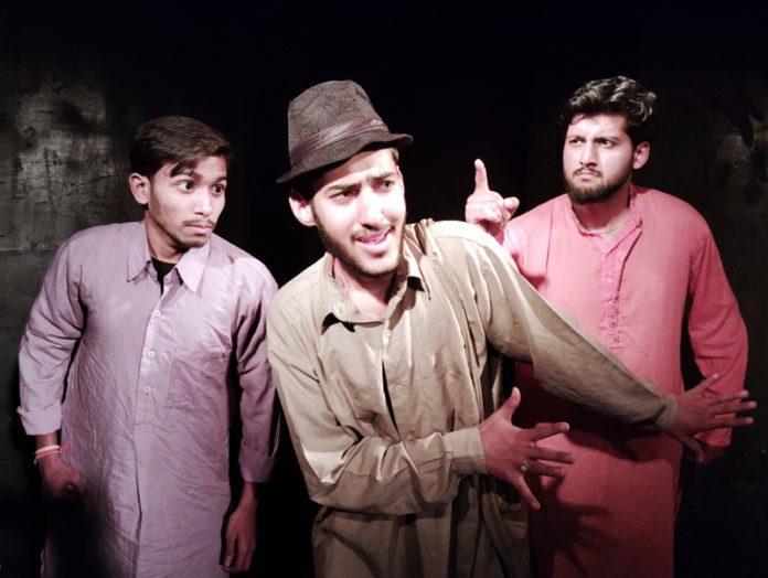 A scene from play ‘Topian’ being staged by Natrang at Jammu on Sunday.