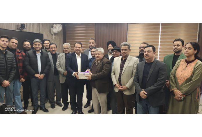 Senior members of FADA Jammu posing with Transport Commissioner J&K, Vishesh Paul Mahajan.