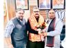 BJP president, Sat Sharma honouring party leader, Zorawar Singh Jamwal at Jammu on Saturday.