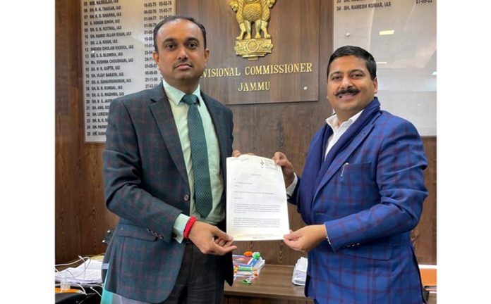 Gaurav Gupta presenting MoU to Divisional Commissioner Jammu, Ramesh Kumar.
