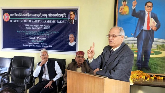 Retired IAS officer BR Kundal addressing a gathering during a program at Roop Nagar, Jammu.