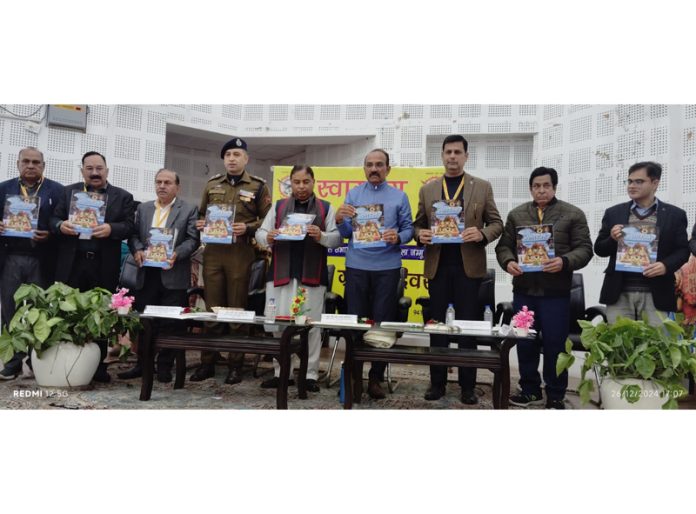 Guests releasing a booklet during Grahak Diwas celebration by ABGP at Jammu on Thursday.