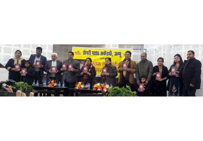 Dignitaries releasing a Dogri book during a function organised in Jammu on Monday. Dignitaries releasing a Dogri book during a function organised in Jammu on Monday.