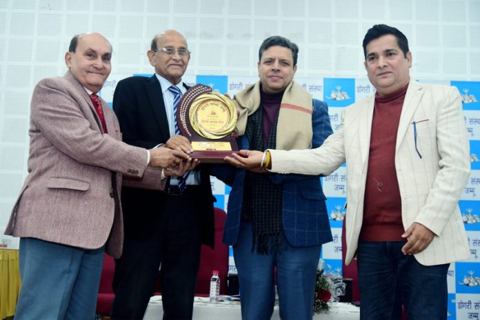Dogri Sanstha honouring Sanjeev Verma, Commissioner Secretary GAD, during Dogri Maanta Din celebration at Jammu on Thursday. Dogri Sanstha honouring Sanjeev Verma, Commissioner Secretary GAD, during Dogri Maanta Din celebration at Jammu on Thursday.
