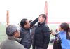 Height measurement of a candidate being done by officials during physical tests for recruitment of Excise Guards at Leh.
