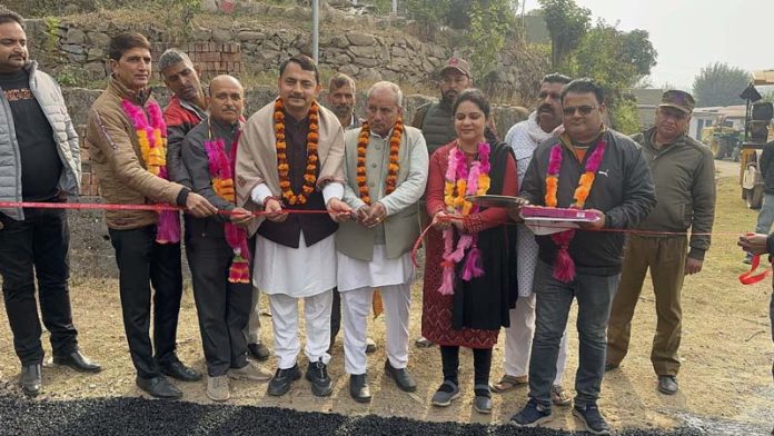 MLA Udhampur East, R S Pathania inaugurating blacktopping work of Goal-Baley road.