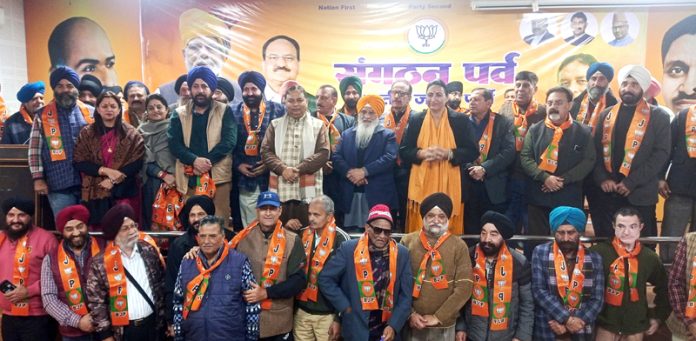 BJP leaders taking new entrants into party fold at Jammu on Friday.