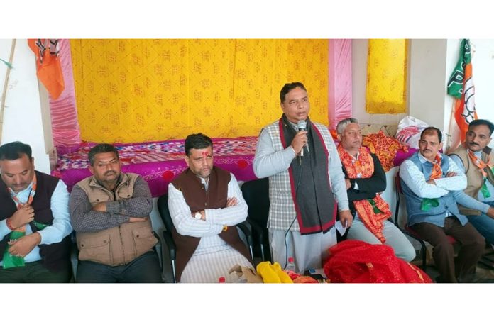 BJP president, Sat Sharma addressing a meeting at village Jaswan in Marh Assembly segment on Friday.