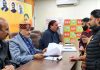 BJP MLAs, Sham Lal Sharma and Mohan Lal Bhagat holding a public darbar at party office, Jammu on Monday.