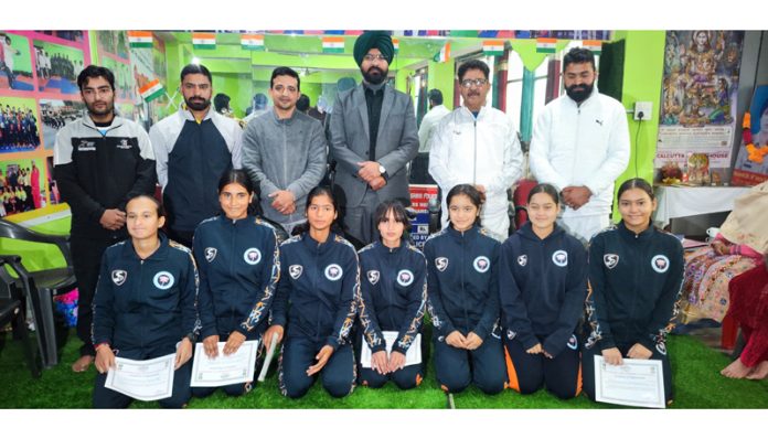 Harvinder Singh, Deputy Commissioner of Doda posing along with athletes.