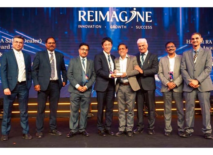 Jitender Kumar Gupta, Director of M/s Varinder Kumar Raman Kumar, Jammu receiving 