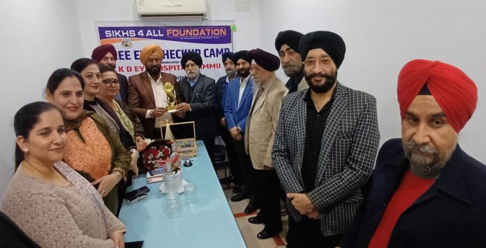 Congress leader Taranjit Singh Tony posing along with members of NGO in Jammu on Tuesday. Congress leader Taranjit Singh Tony posing along with members of NGO in Jammu on Tuesday.