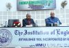 Dignitaries on dais during the celebration of Energy Conservation Day by Institution of Engineers (India), Jammu center on Saturday.