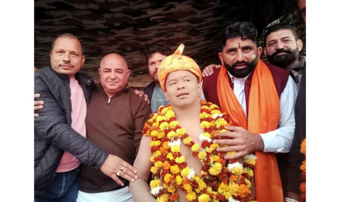 Dignitaries posing along with a wrestler at Channi Targwal on Sunday.