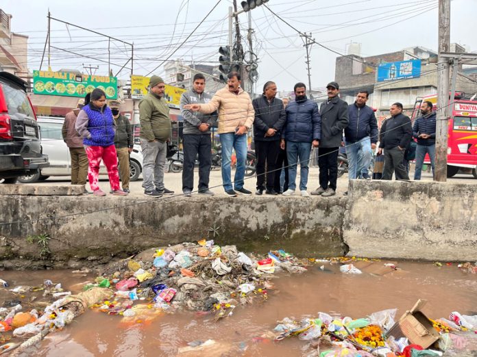 BJP leader, Arvind Gupta inspecting irrigation canal in Talab Tillo area on Tuesday.