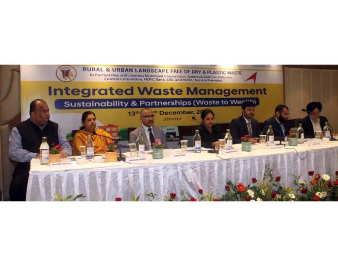 Guests and dignitaries during a workshop on integrated waste management practices in Jammu on Friday.