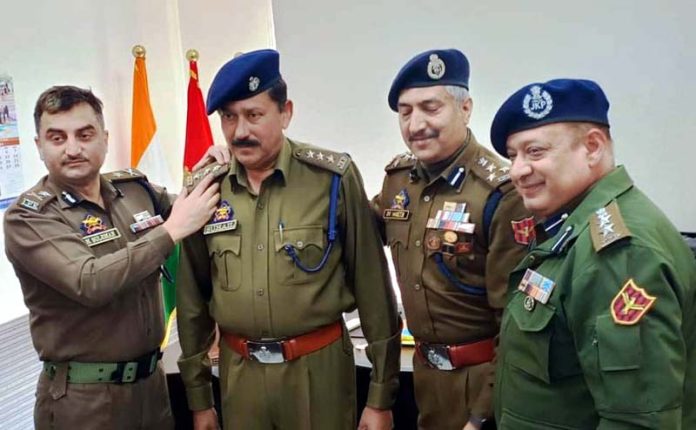 Officer being pinned with new rank during a piping ceremony at Jammu on Friday.