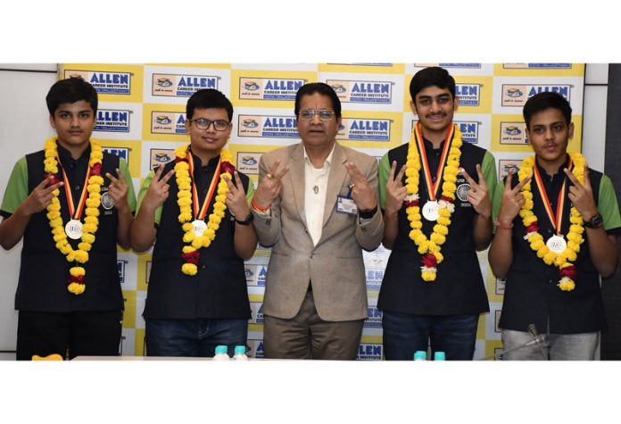 Students of Allen Career Institute posing along with medals on Monday.