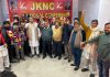 Workers raising slogans during joining of National Conference on Sunday.