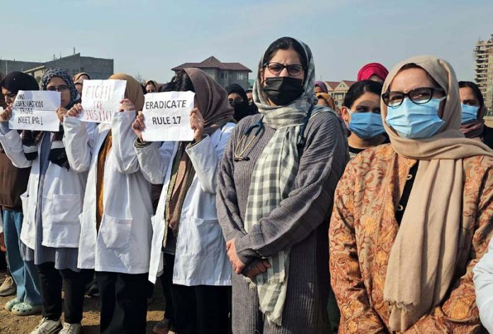 Doctors during a protest at SKIMS MC Bemina on Tuesday. -Excelsior/Shakeel Doctors during a protest at SKIMS MC Bemina on Tuesday. -Excelsior/Shakeel
