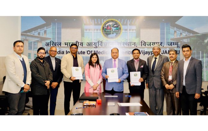 AIIMS Jammu and 4baseCare dignitaries posing for a photograph after joining hands to fight cancer.