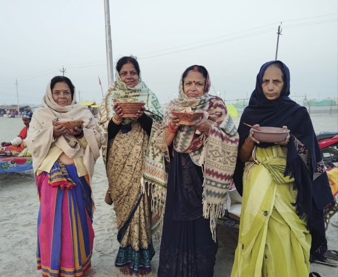 Devotees perform rituals as they observe 'Kalpvas', a month-long ancient practice in Hindu tradition, at the Sangam in Prayagraj./